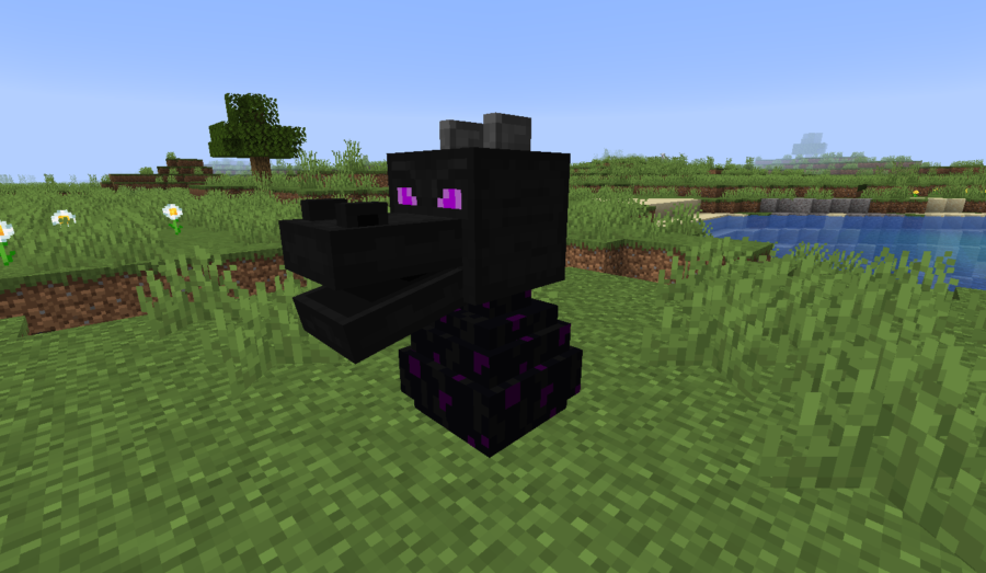 Une tête de dragon sur un œuf de dragon Minecraft.