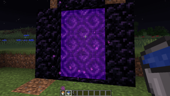 A Nether Portal with buckets in inventory.