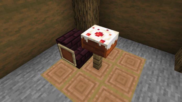 A Cake in front of a chair in Minecraft.