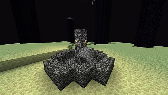 Une fontaine rocheuse avec des torches dans un biome du désert dans Minecraft.