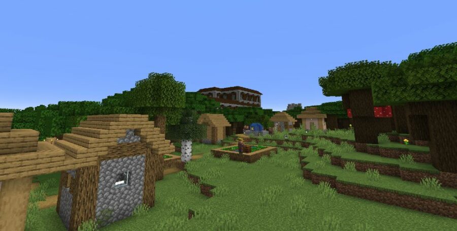 Un village près d'un manoir dans Minecraft.