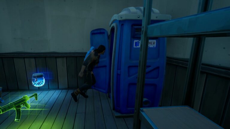 Darryl rushing into a porta potty.