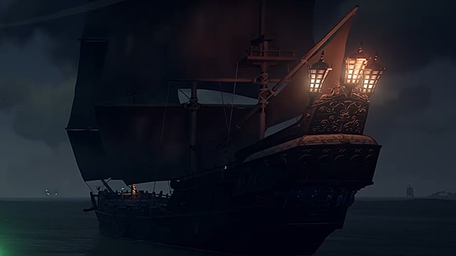 Le bateau pirate Black Pearl en eau libre la nuit.