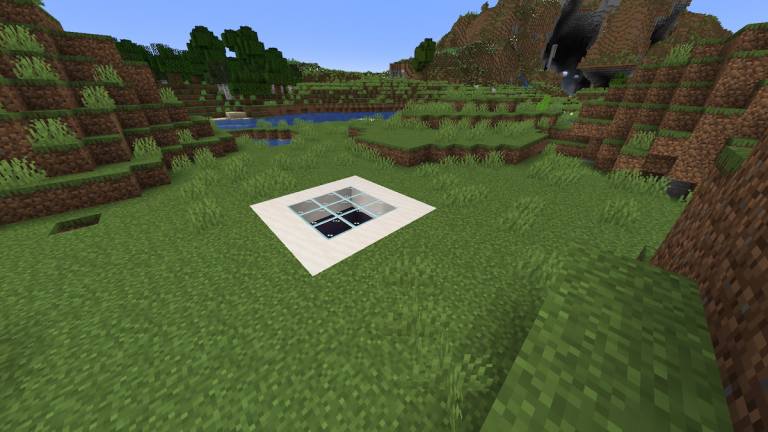 An underground base seen from the surface, with a smooth Sandstone and Glass top.