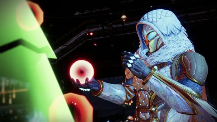 A Guardian admiring a holiday oranment during the Dawning 2023