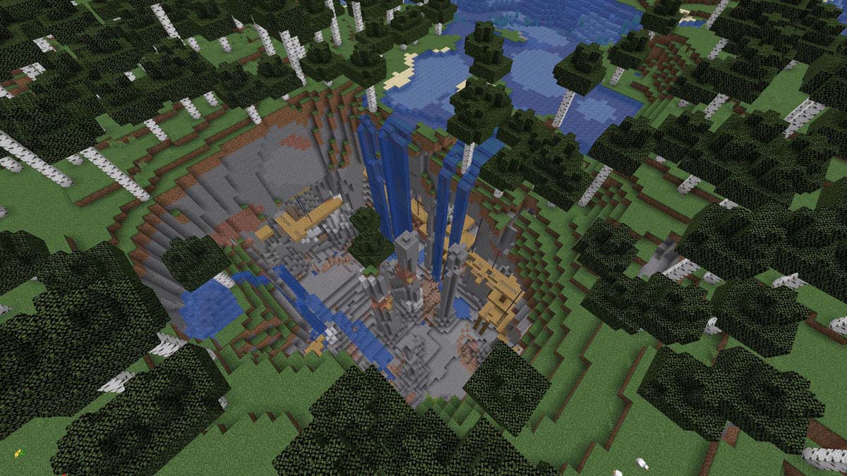 Gigantesque grotte exposée avec puits de mine et cascades dans Minecraft