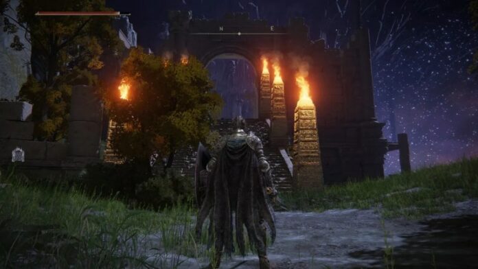 A Knight in tattered armor standing by a flame pillar in Nokron in Elden Ring.