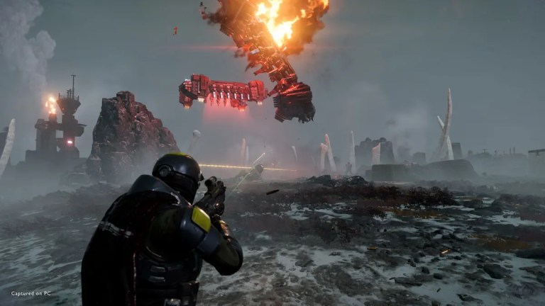 futuristic soldier in tactical armor shoots at a falling flaming mech