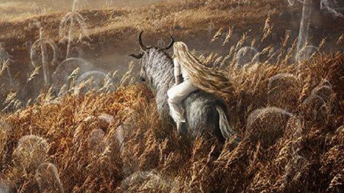 Figure dans un champ de blé sur un cheval