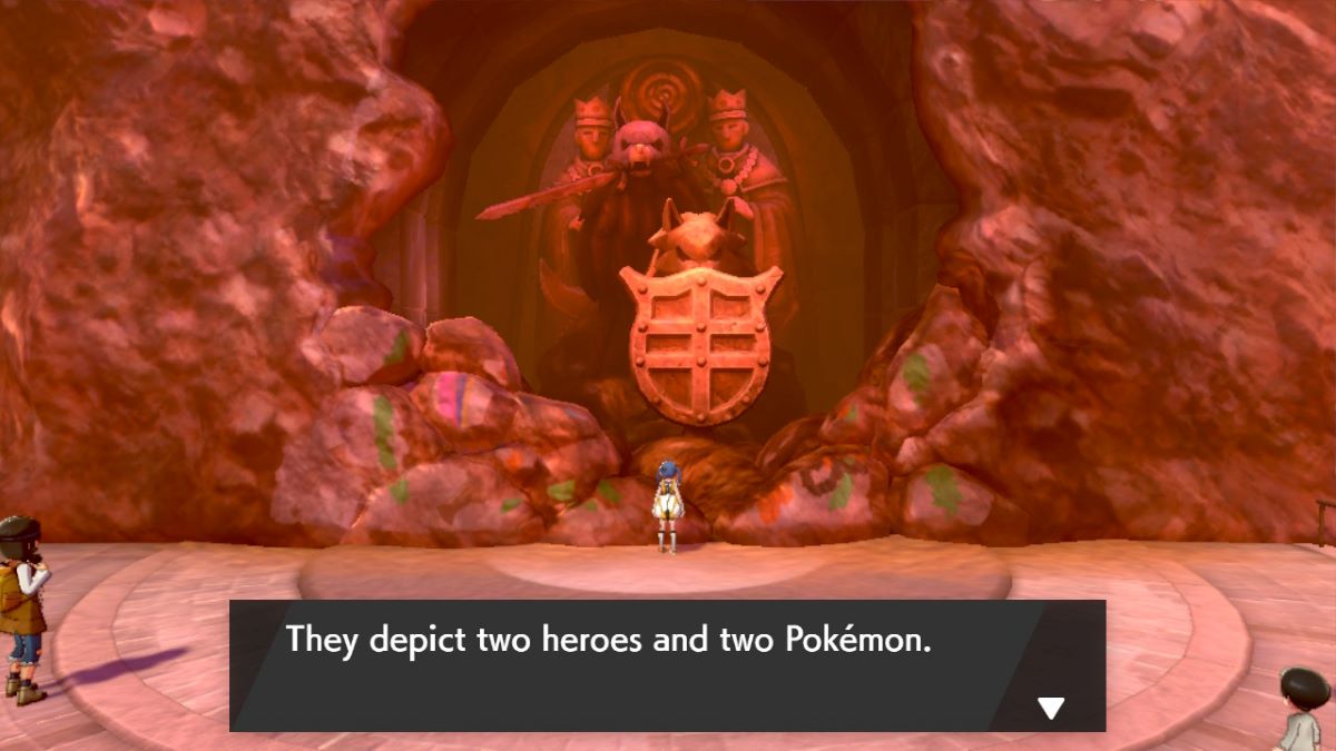 Un joueur inspecte des statues représentant deux héros et deux Pokémon dans Pokemon Sword & Shield