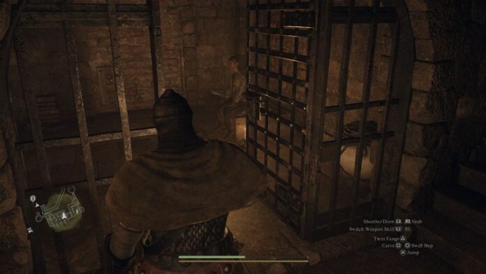 dragons dogma 2 player in prison standing in front of an open cell with a prisoner inside