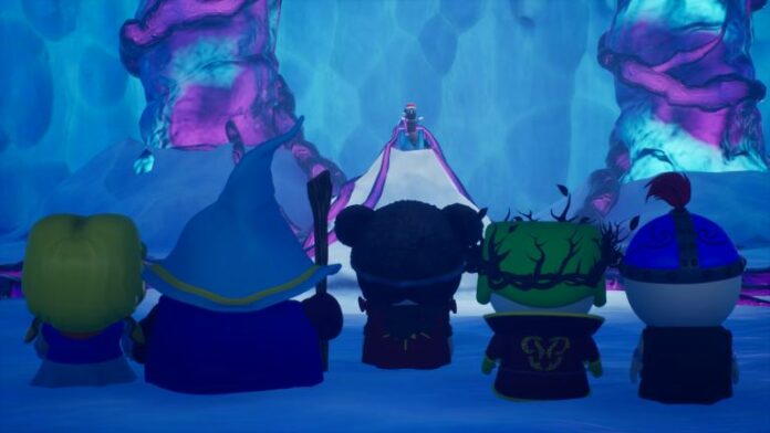 Players standing in a line with their backs to the screen, facing Mr. Hankey on a pedestal