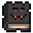 Livre noir avec un visage de monstre, des yeux rouges et une bouche souriante avec des crocs