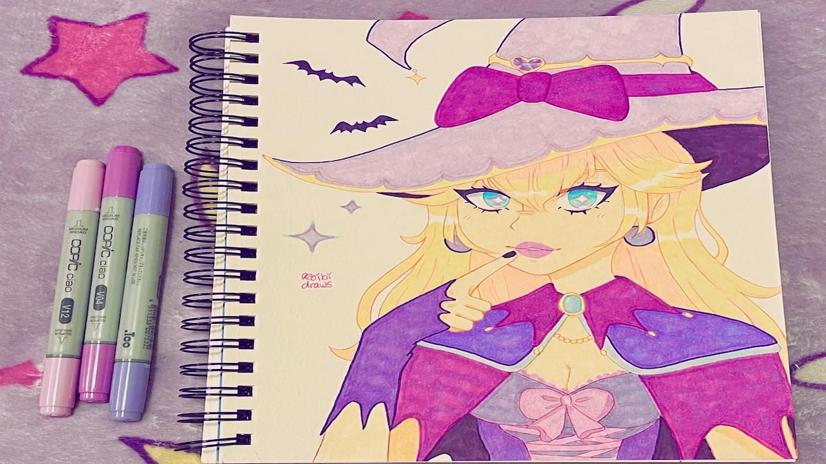 Art de la princesse Peach avec un chapeau de sorcière, une cape et des gants violets, des chauves-souris et des étincelles autour d'elle sur un carnet avec des marqueurs à côté 