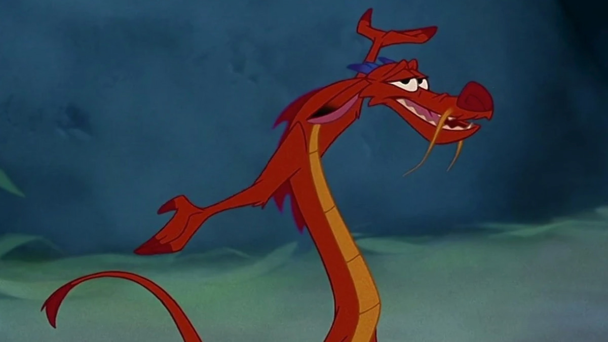 Mushu le dragon de Mulan avec les bras tendus et souriant
