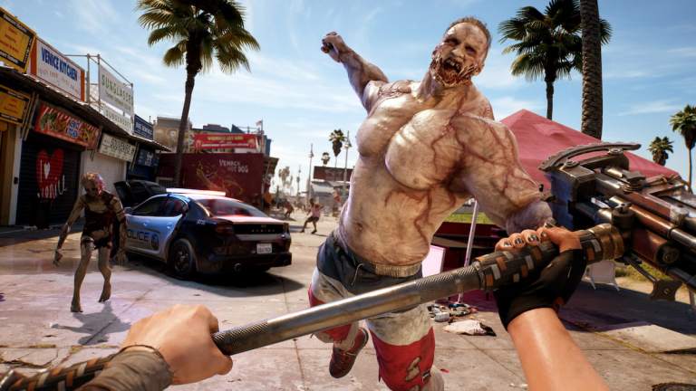 Promo image for Dead Island 2, showing a large hulking zombie about to punch the player in Venice Beach.