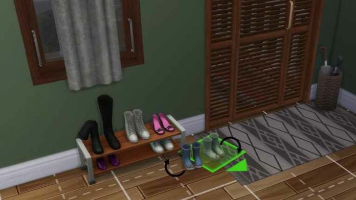 Muddy rain boots by the door selected and with two arrows showing rotation