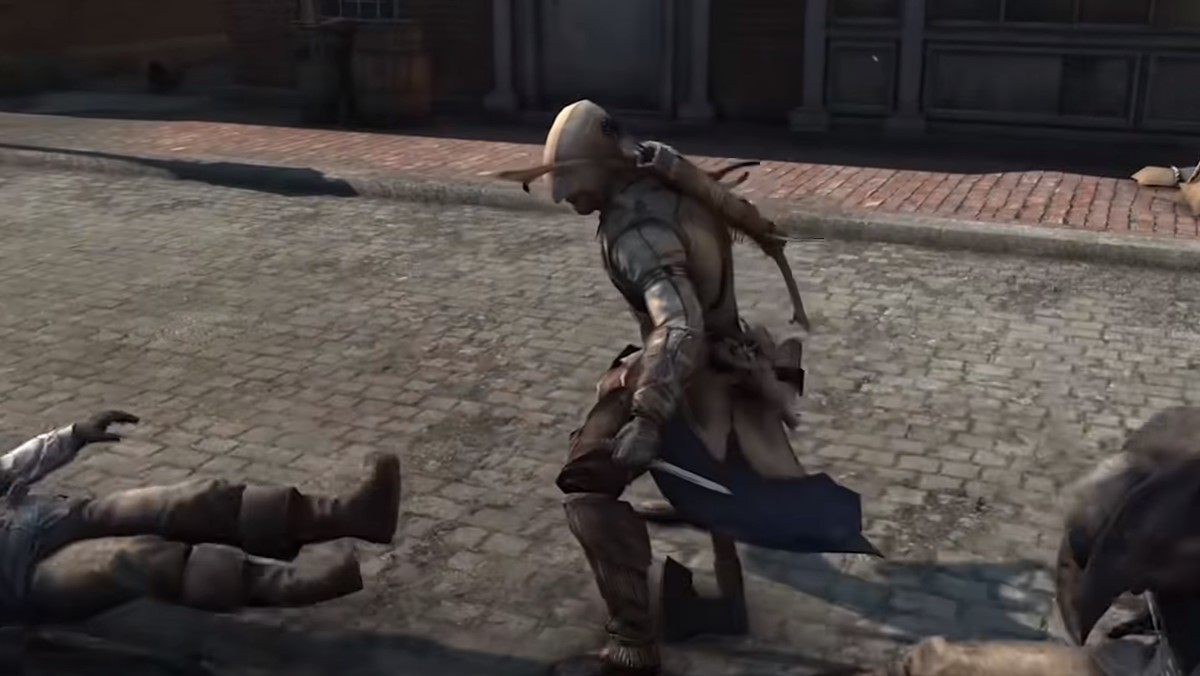Connor Kenway utilisant une lame cachée dans Assassin's Creed III.