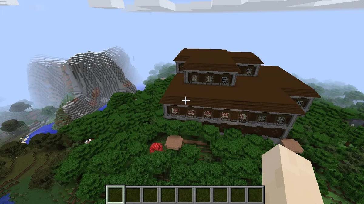 Manoir boisé près d’une montagne dans Minecraft