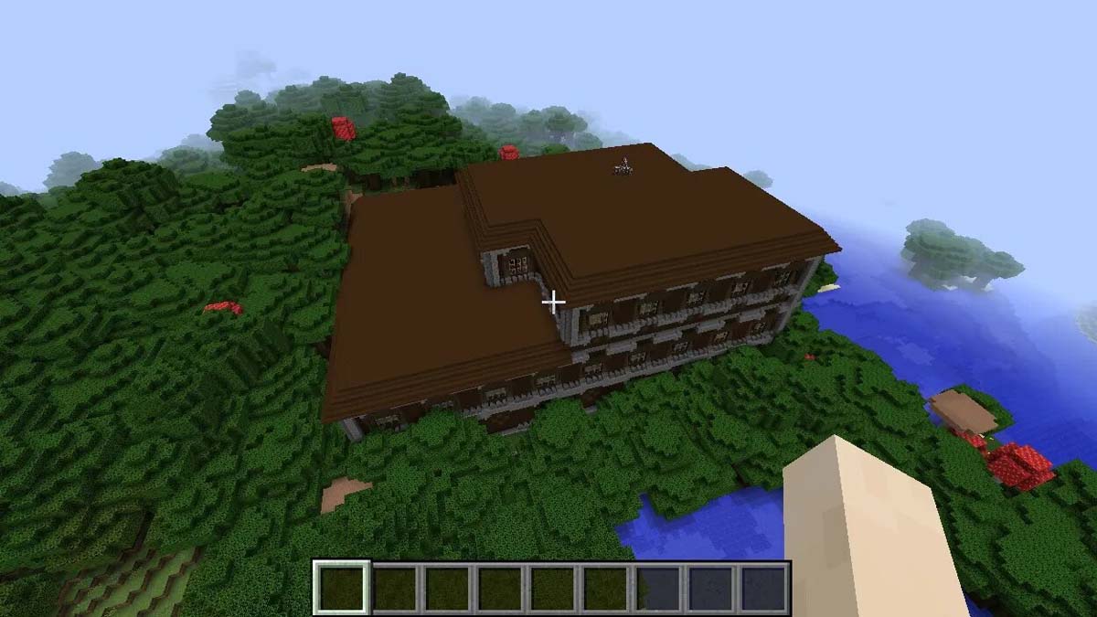 Manoir boisé sur la rivière dans Minecraft