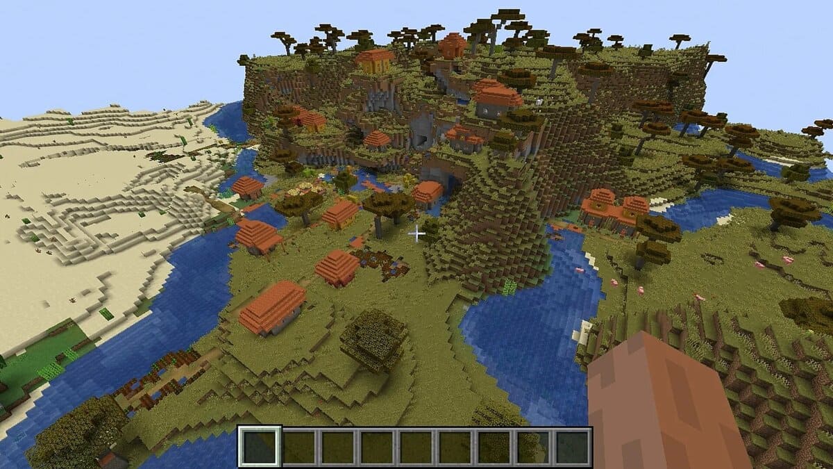 Village d'acacias à flanc de colline dans Minecraft