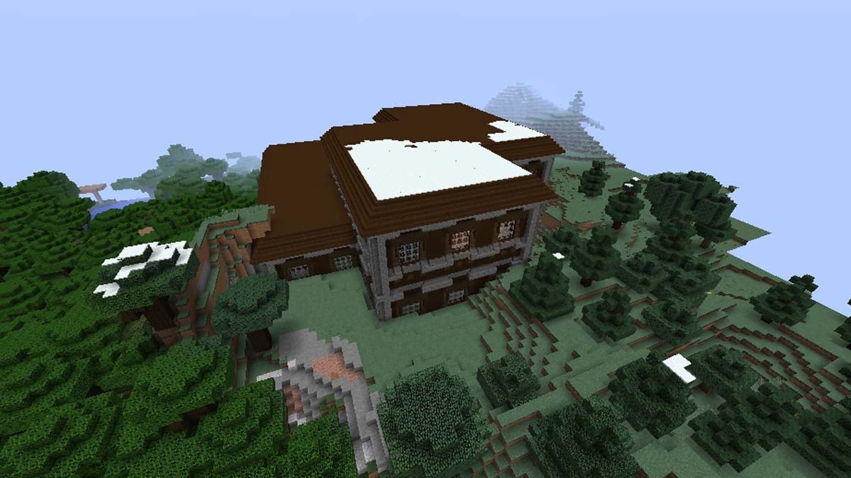 Neige recouvrant un manoir boisé dans Minecraft