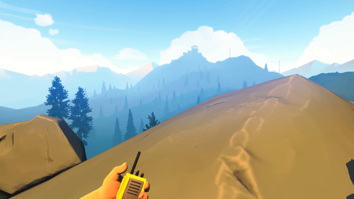 Joueur observant une montagne au loin dans Firewatch.