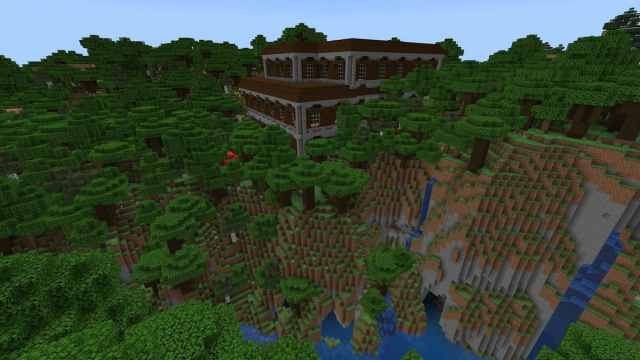 Un manoir en bois de minecraft sur le bord d'un canyon