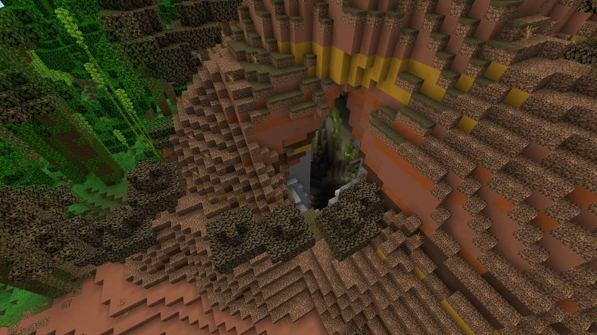 Une grotte luxuriante cachée sur le côté d'une colline de Badlands à Minecraft